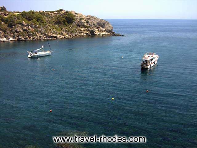 YACHTS - A yacht and a motor yacht in Ladiko bay in Rhodes