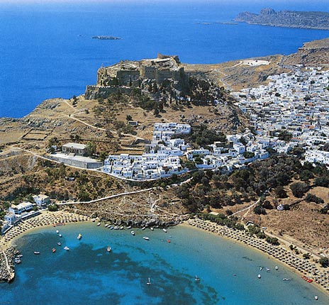 LINDOS VIEW - Its houses, perched on the hillsides, stand out in dazzling white against the blue background of sky and sea.